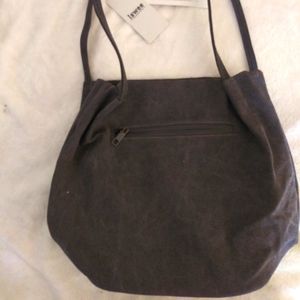 Two bucket bags. One grey one brownish grey.